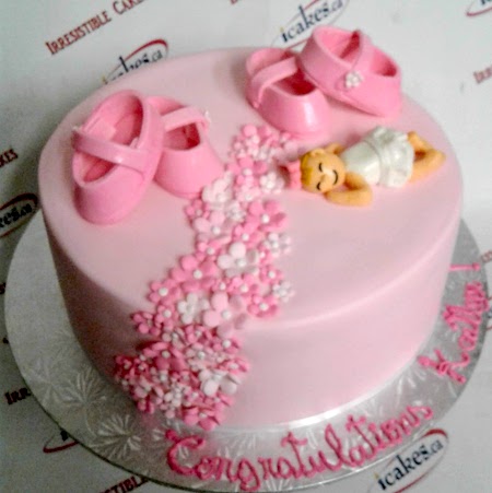 Sleeping girl with shoes baby shower cake from Iressitible Cakes Scarborough